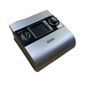 A small, square, silver-colored device with a screen and buttons.