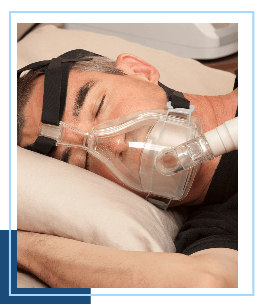 image of someone using a sleep apnia machine