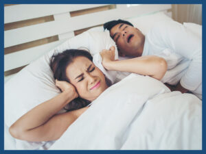 image of a man and woman dealing with sleep apnea