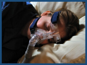 Image of a man using a CPAP machine