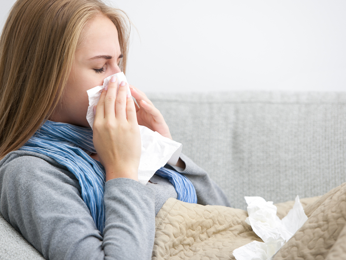 person blowing their nose