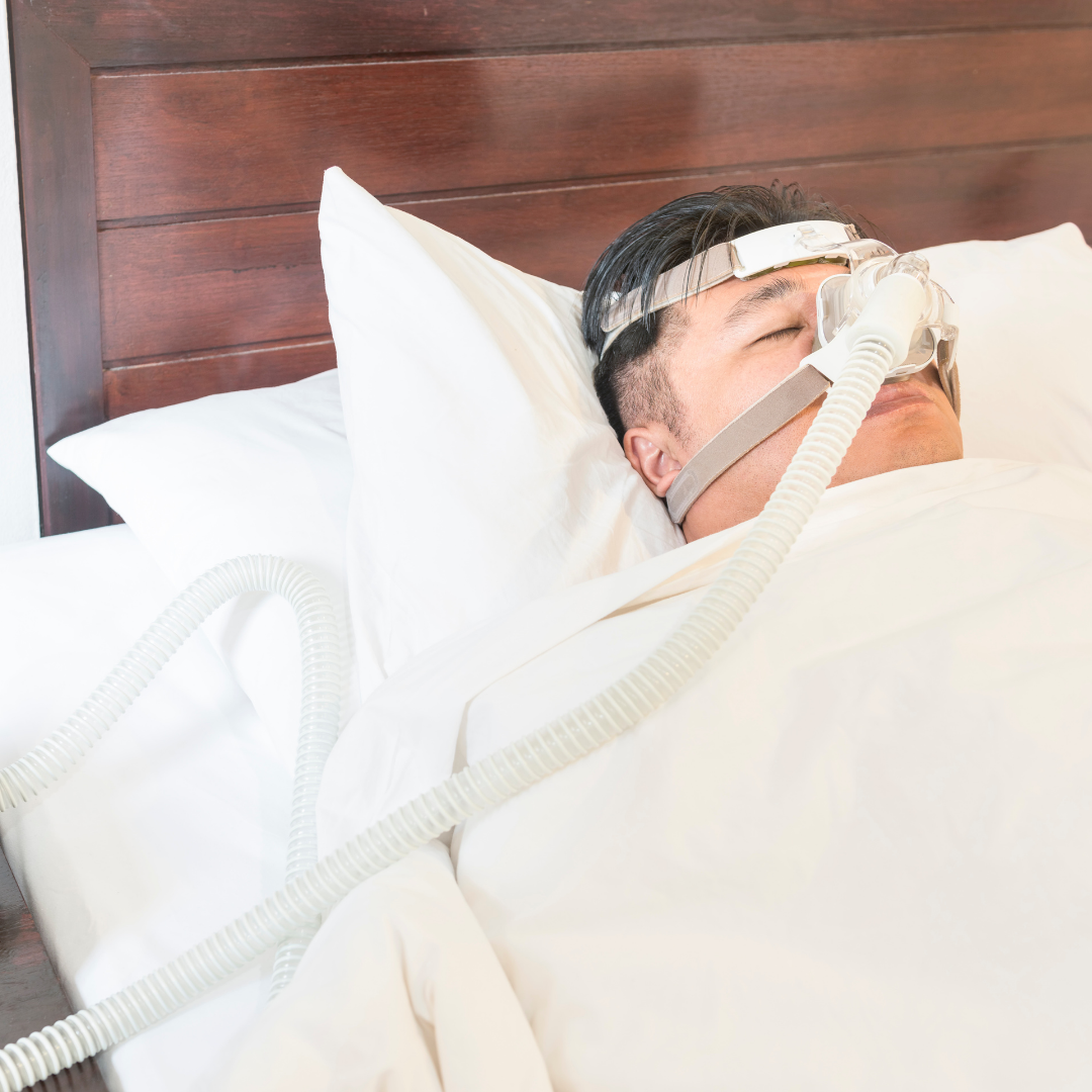 img of someone using a cpap machine