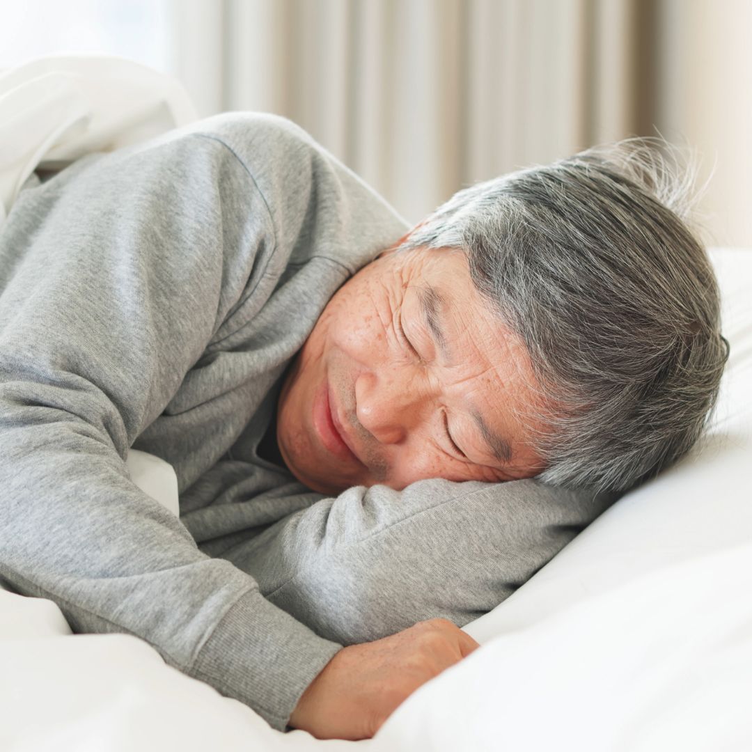 a sleeping senior man