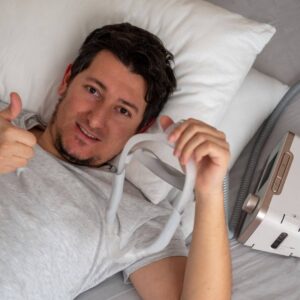 person holding CPAP machine